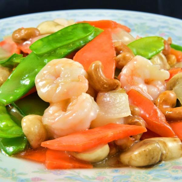 Cashew Nuts Shrimp · Shrimp, with cashews and either a light brown garlic sauce and thick sauce made from chicken stock, soy sauce and oyster sauce. Served with steamed rice.