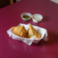 2 Pieces Samosas · The samosa is made with all vegetables. It contains mashed boiled potatoes, green peas, lent...
