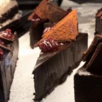 Flourless Chocolate Cake Slice  · topped with raspberry 