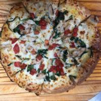 White Pizza · Sundried tomatoes, artichoke hearts, feta and mozzarella with butter-garlic sauce. 