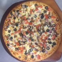 Grilled Garlic Chicken Pizza · Grilled chicken, diced Roma tomatoes, red onions, fresh parsley and mozzarella with creamy g...