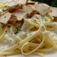 Chicken Fettuccine Alfredo · Served with garlic bread and dinner salad. 