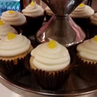 Lemon Drop · Vanilla cake filled with lemon filling, frosted with lemon buttercream, and topped with a dr...