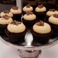 Peanut Butter Cup · Chocolate cake frosted with peanut butter cream cheese and topped with crushed Reese's peanu...
