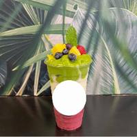 The Fruit Tour Smoothie · Mango spinach at the top pina colada in the middle strawberry blend at the bottom.