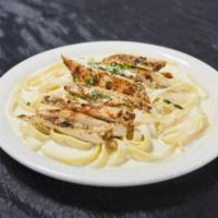 Fettuccine Chicken Alfredo · Chicken and Alfredo sauce. Served with salad and bread.