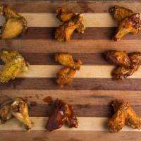 10 Piece Wings (Bone-In or Boneless) · Chicken Wings brined for 24 Hrs and sauced with our homemade blend of sauces!

Up to 2 flavo...