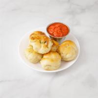 6-Piece Garlic Knots · Pizza dough knots marinated with fresh garlic and virgin olive oil and seasoned. 