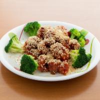 5. Sesame Chicken · Chunks crispy chicken dry sauteed in Peking sauce with sesame seeds around.