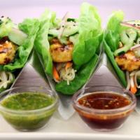Lettuce Wrap  · Chicken and vegetable sauteed with Thai sauce, lettuce bowl on the side.