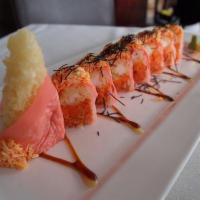 Angry Dragon Roll · Shrimp tempura, spicy tuna, sliced papaya, king crab salad on top. Served with nuta sauce.