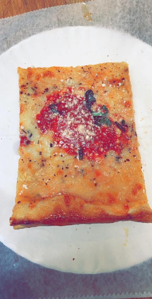 Grandma Pizza Slice · Thin Sicilian with fresh Garlic, Mozzarella, Basil, Parmesan Cheese and homemade Tomato Sauce.