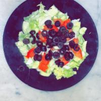 House salad · Lettuce, cucumbers, tomatoes, onions black olives and Italian dressing.