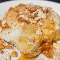 Peach Cobbler · Enjoy a homemade classic golden brown buttery, sweet and fluffy sweet roll. Topped with gran...