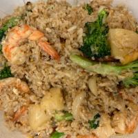 Pineapple Fried Rice · Stir-fried with yellow curry powder, jasmine rice, egg, pineapple chunks, tomatoes, broccoli...