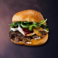 That French Burger · 6 oz. 100% Angus beef patty, brie, grilled mushrooms, berry jam, arugula, black truffle mayo.