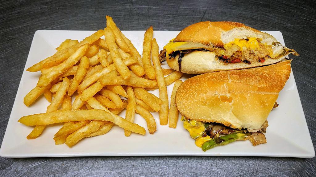 Jersey Chicken Cheese Steak · Thinly sliced chicken, peppers, onions, jalapeños, and mushrooms smothered in brown gravy and cheese on a hero roll and served with fries.