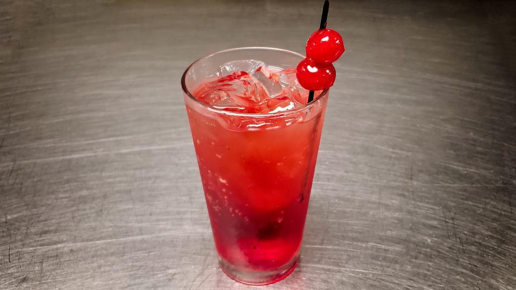 Shirley Temple · Ginger ale and a splash of grenadine, garnished with a maraschino cherry.