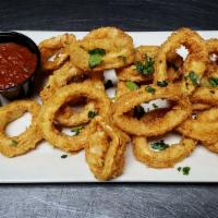 Calamari · Generous calamari rings fried and served with chipotle marinara sauce.