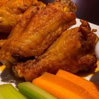 Wings  · Crispy golden brown wings tossed in your choice of signature sauces.