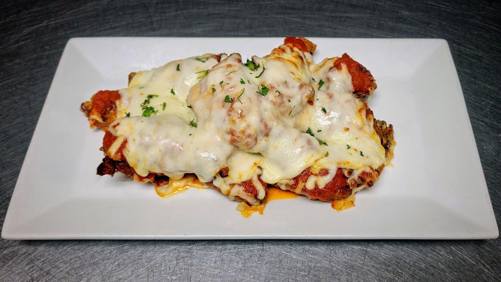 Chicken Parm Wings · Our crispy golden brown wings smothered in marinara, parmesan cheese and mozzarella cheese.