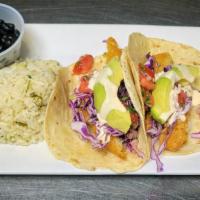 Fish Tacos · Beer battered Cod topped with avocado, cabbage, pico de gallo and our house made remoulade s...