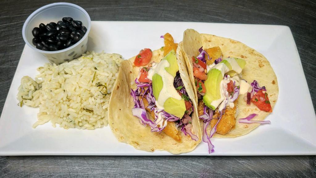 Fish Tacos · Beer battered Cod topped with avocado, cabbage, pico de gallo and our house made remoulade sauce. Served with white rice and black beans.