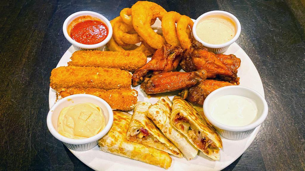 Tap Room Sampler Family Size · A family size portion of 3 orders of our sampler platter which includes our wings, onion rings, Colorado quesadilla, and our fresh mozzarella sticks.