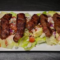 Steak GF · Ribeye steak cooked to your liking served over our signature mix of romaine and iceberg, wit...