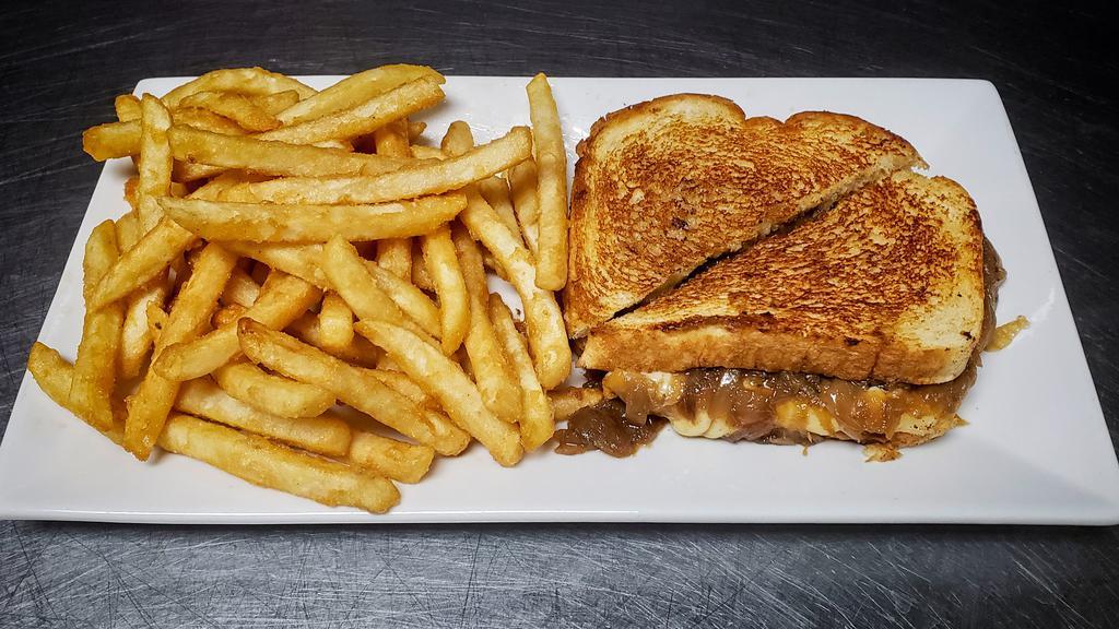 French Onion Grilled Cheese · French onion soup meets grilled cheese sandwich with this Gruyère smothered carmelized onion grilled and buttered sourdough.