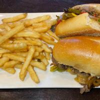 Jersey Cheese Steak · Thinly sliced steak, peppers, onions, jalapeños, and mushrooms smothered in brown gravy and ...