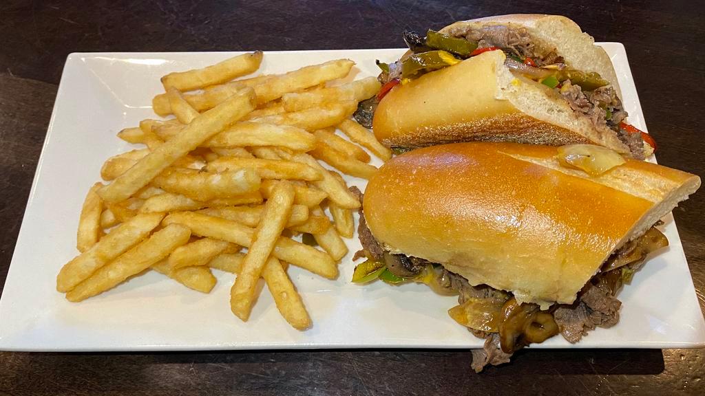 Jersey Cheese Steak · Thinly sliced steak, peppers, onions, jalapeños, and mushrooms smothered in brown gravy and cheese on a hero roll.