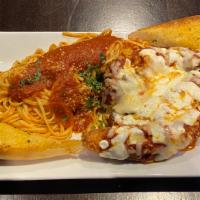 Chicken Parm Over Linguini · Our boneless chicken breast coated in our signature panko mix covered in marinara sauce, 
 m...