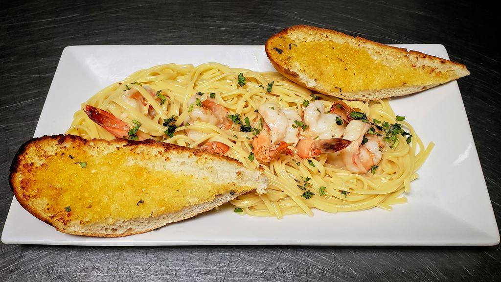 Garlic Shrimp Over Linguini · Linguini with shrimp in a garlic white wine sauce and served with flat bread.