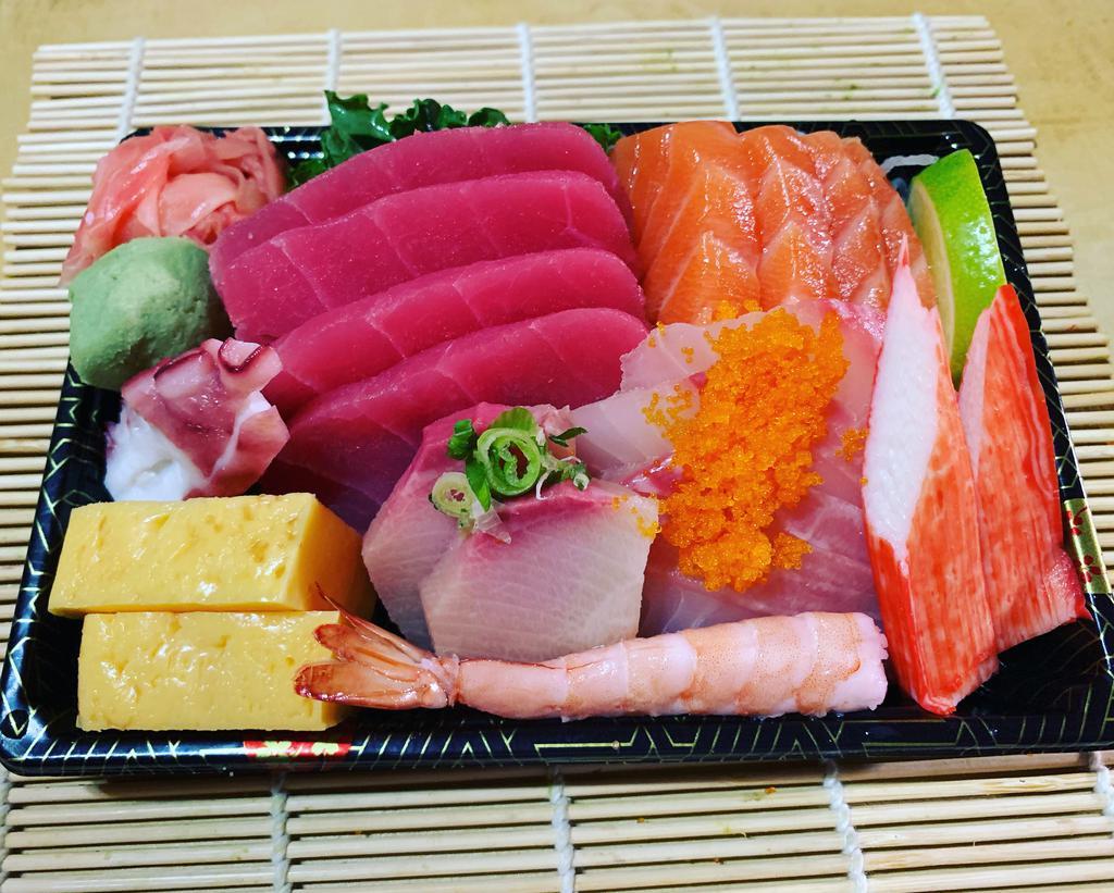Sashimi Deluxe Combo · 10 pieces of assorted sushi. Served with miso soup or white rice.