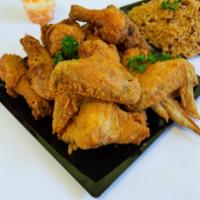 Fried Chicken · 3 of our famous fried chicken legs on a dinner plate!