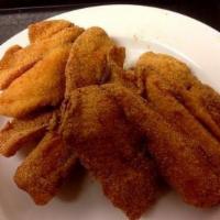 Tilapia Dinner  · 2 Tilapia fillets marinated in our house spices then fried to golden brown perfection! 