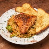 Blackened salmon pasta · Pan seared blackened over linguine pasta tossed in a cajun cream sauce with peppers, onions,...