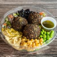 Quinoa Falafel Bowl · Kale topped with quinoa, falafels, shredded carrots, shredded beets, black beans, roasted co...