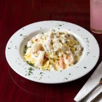 Fettuccine Mediterraneo · Gulf shrimp, scallops, creamy Alfredo sauce crab meat, Parmesan, and fettuccine.