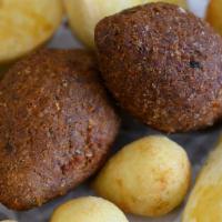 Kibbeh  · Kibe. Deep-fried ground bulgur wheat and ground beef mix croquette.