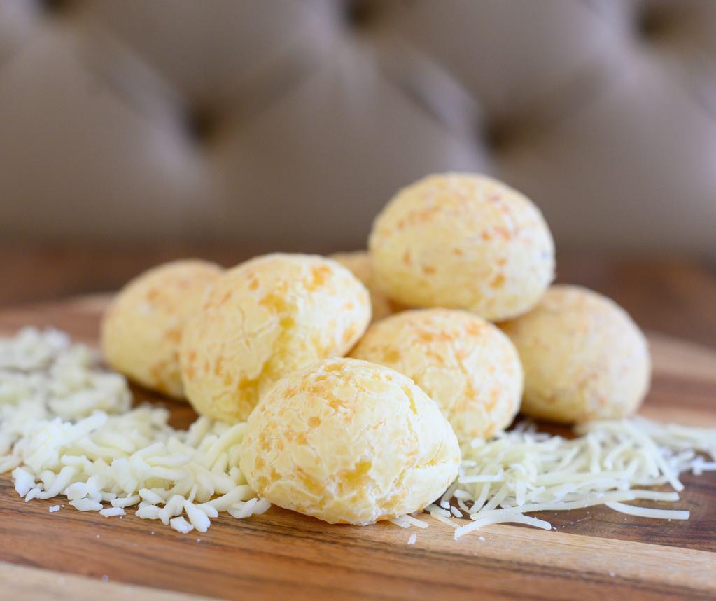 Cheese Bread Tradicional · Pao de queijo. Cheese bread “pao de queijo” in portuguese, is a small baked cheese roll bun, made with cassava flour and cheese. Gluten free.
Other ingredients: Egg, Milk, Salt, Butter.