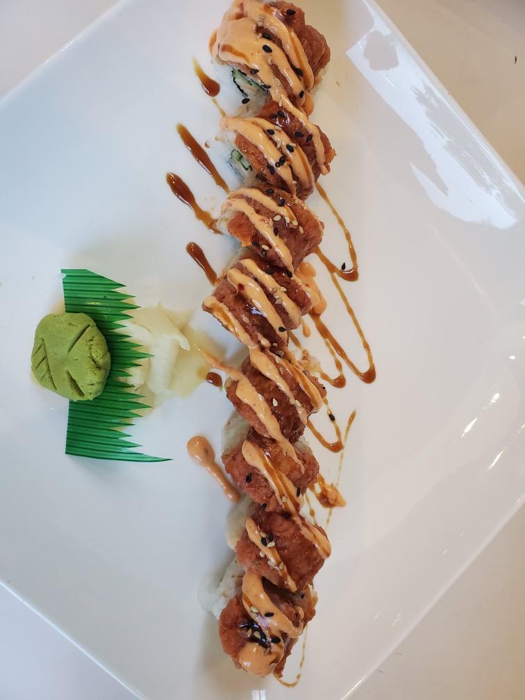 Red Dragon Roll · Shrimp tempura, sushi rice, nori, top spicy tuna, spicy mayo & sesame seeds.