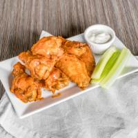 Wings · Choice of signature sauce: Buffalo sauce, Barbecue sauce and Cajun seasoning. Served with ce...