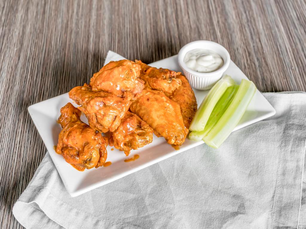 Wings · Choice of signature sauce: Buffalo sauce, Barbecue sauce and Cajun seasoning. Served with celery and choice of blue cheese or ranch.
