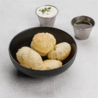 Dahi Puri · 6 pieces. Round, hollow puri fried crisp and filled with a mixture of tamarind chutney, gree...