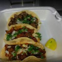 3 Tacos Meal · Choice 3 tacos, cilantro, onions, rice, and beans.