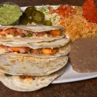 Shrimp Quesadillas Entree · 3 flour tortillas filled with grilled shrimp, melted cheese and pico de gallo. Served with f...