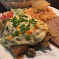 Tex Mex Tamales Dinner · 3 pork tamales topped with ground beef, melted cheese and green onion.