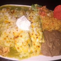 Enchiladas Suizas Dinner · 3 corn tortillas dipped in spicy green chile sauce filled with choice of cheese, bean, chick...
